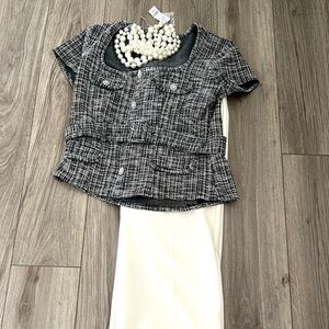 Short sleeve, embellished, belted top.
Demure & sophisticated.